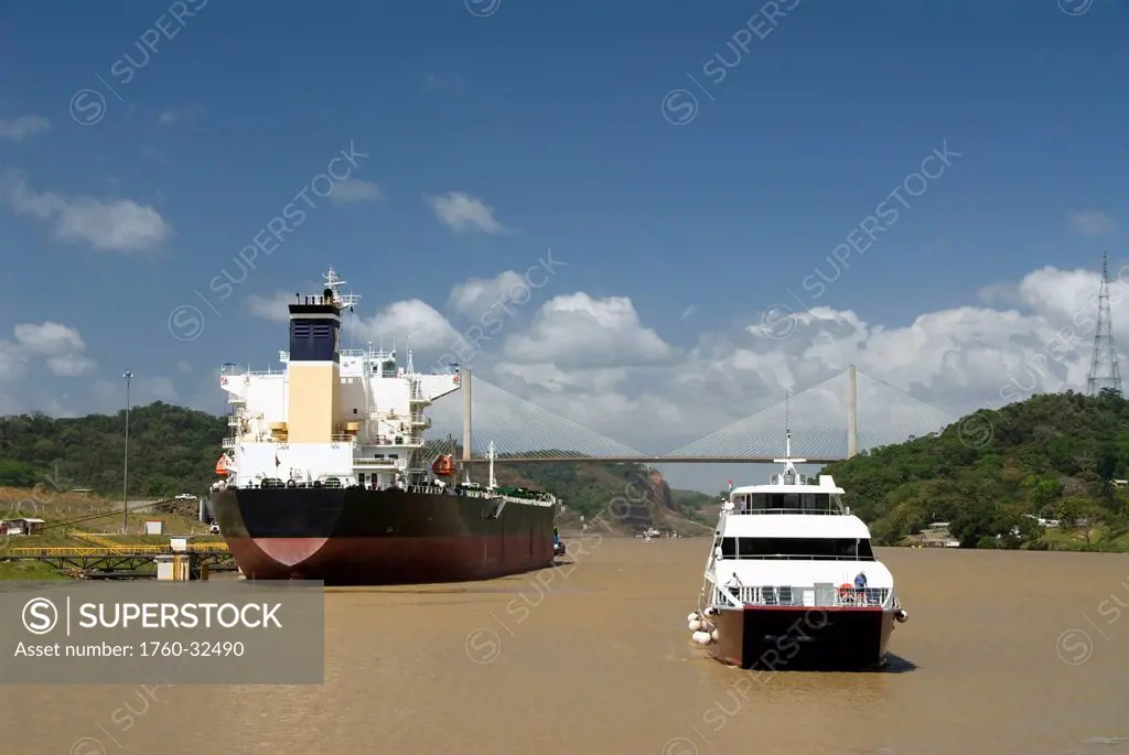 Panama, Panama Canal, Cruise Boat Coming Into Pedro Miguel Lock, New Millennium Bridge With Waiting Ship