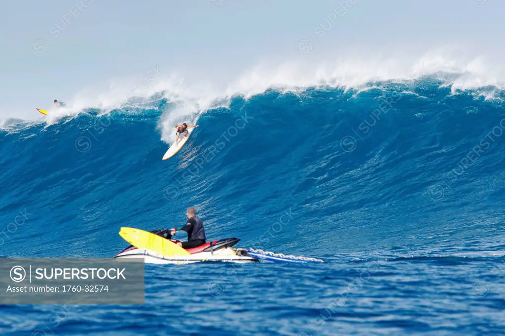 Hawaii, Maui, Peahi, Surfer Rides A Giant Wave At Peahi Also Know As Jaws With Lifeguards Ready For Safety. Editorial Use Only.