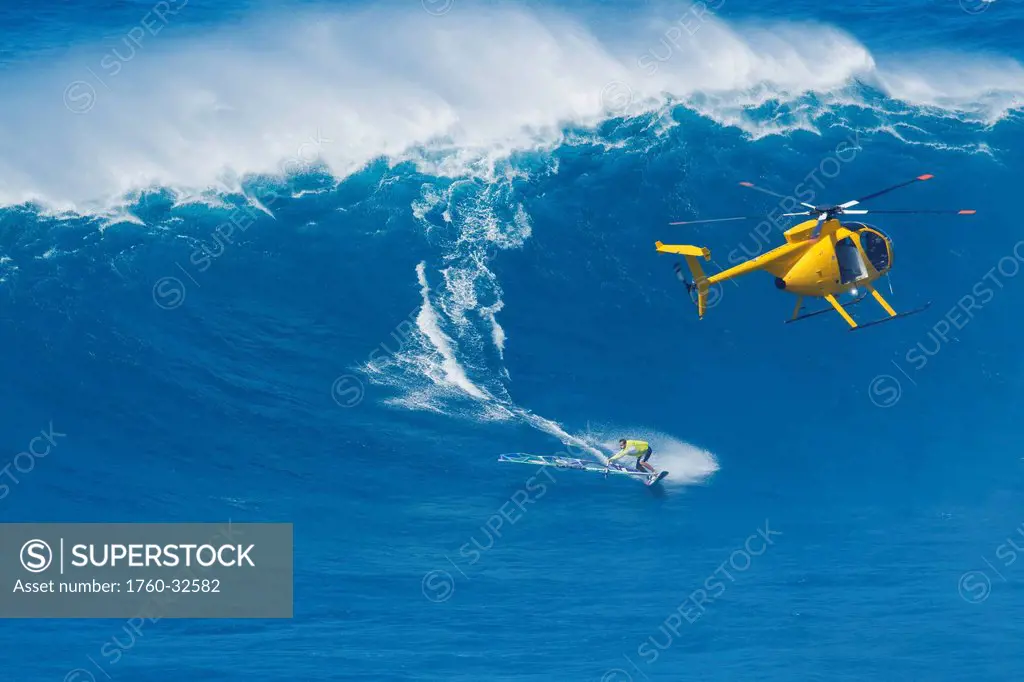 Hawaii, Maui, Professional Windsurfer Robby Naish Catches A Large Wave At Peahi, Also Know As Jaws. Editorial Use Only.