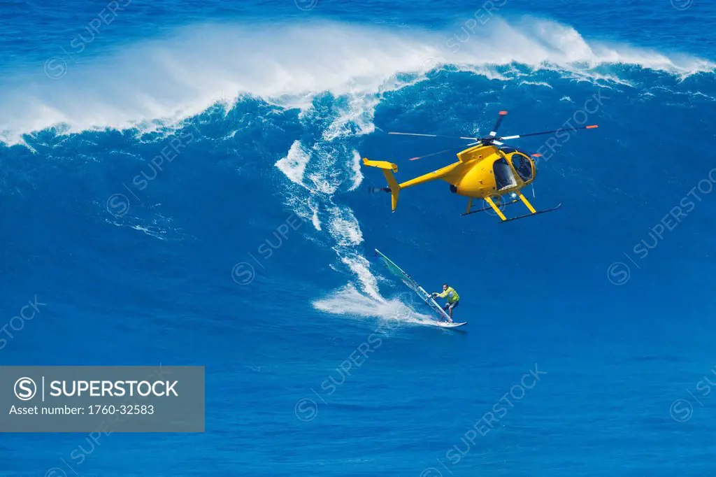 Hawaii, Maui, Professional Windsurfer Robby Naish Catches A Large Wave At Peahi, Also Know As Jaws. Editorial Use Only.