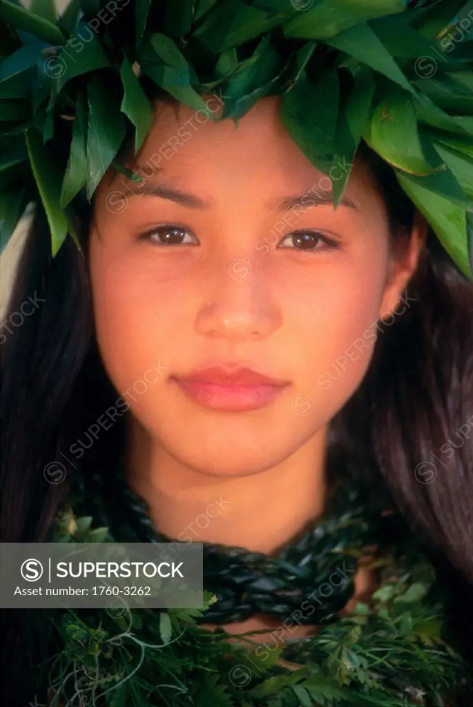 Closeup portrait shot of attractive polynesian girl with green haku C1446