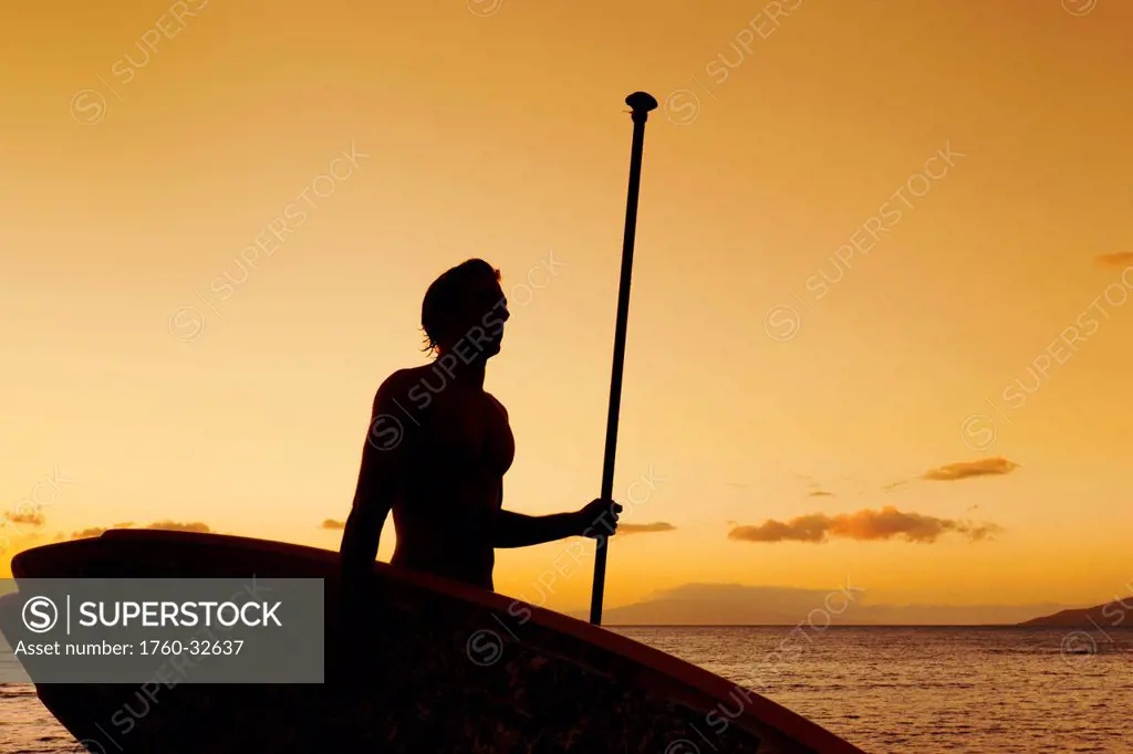 Hawaii, Maui, Wailea, Silhouette Of Young Man With Stand Up Paddle Board At Sunset