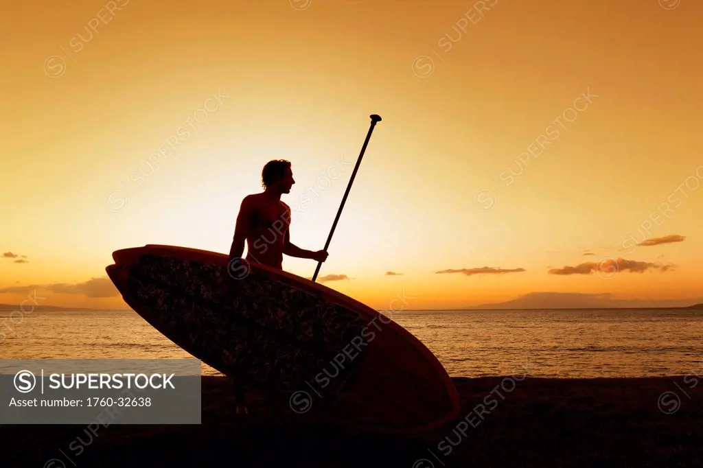 Hawaii, Maui, Wailea, Silhouette Of Young Man With Stand Up Paddle Board At Sunset