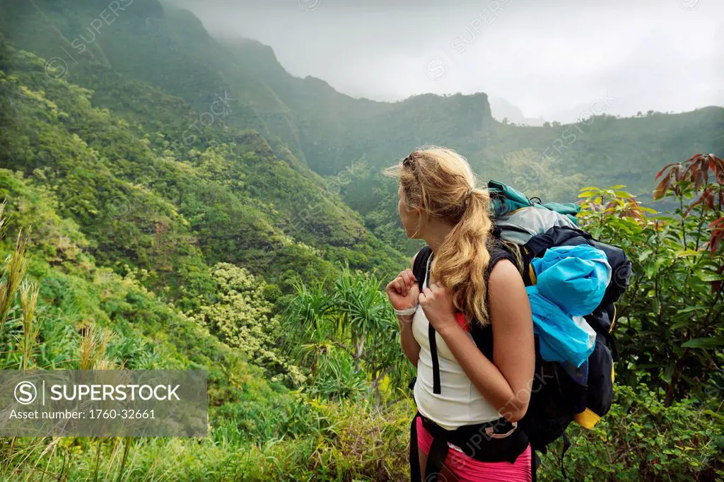 Hawaii, Kauai, Napali Coast, Woman Hiking On The Napali Coast Trail.