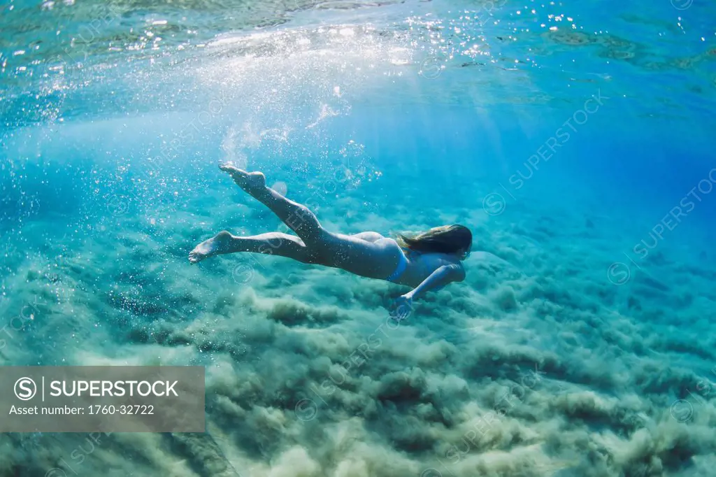 Hawaii, Maui, Makena, Young Woman Swimming In Ocean.