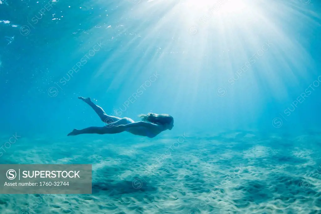 Hawaii, Maui, Makena, Young Woman Enjoys A Swim In The Ocean.