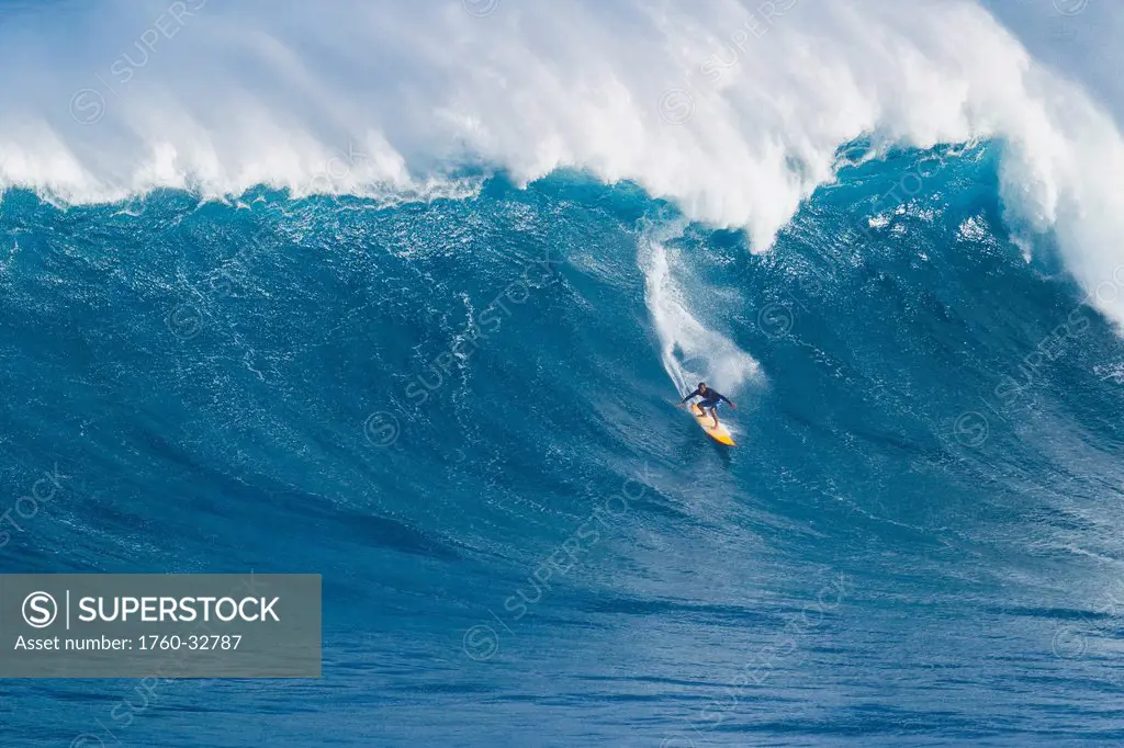 Hawaii, Maui, Peahi, Professional Surfer Robbie Naish Stand Up Paddling Giant Wave At Jaws.