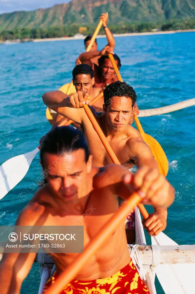 Hawaii, Oahu, Waikiki, Close-Up Of Paddlers In An Outrigger, On Ocean, Diamond Head In Background