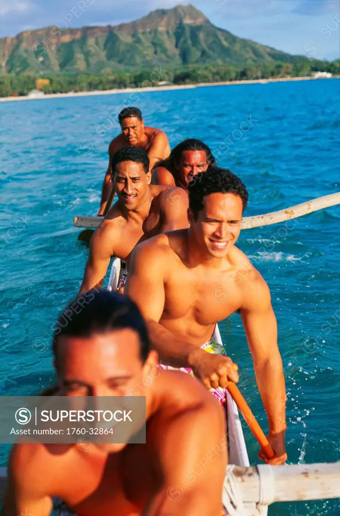 Hawaii, Oahu, Waikiki, Close-Up Of Paddlers In An Outrigger, On Ocean, Diamond Head In Background