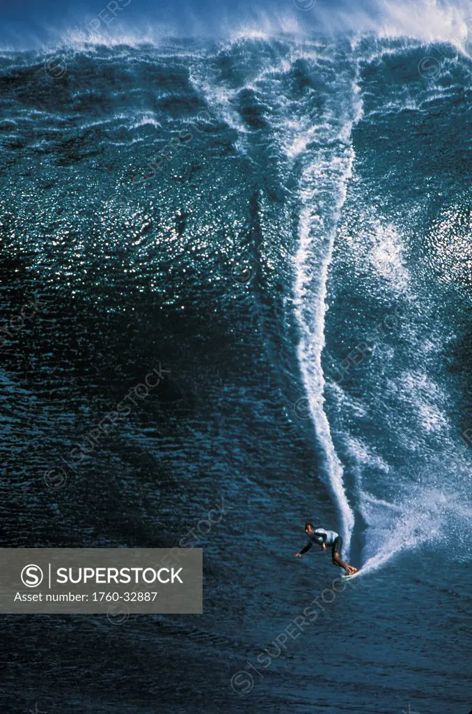 Hawaii, Maui, Long Shot Michelle Larronde Peahi Surfing Jaws (Huge Dark Blue Wave) .
