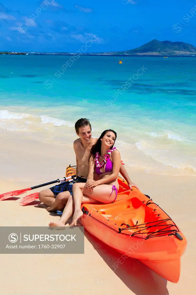 Hawaii, Lanikai, A Young Couple With Their Kayak On The Beach.