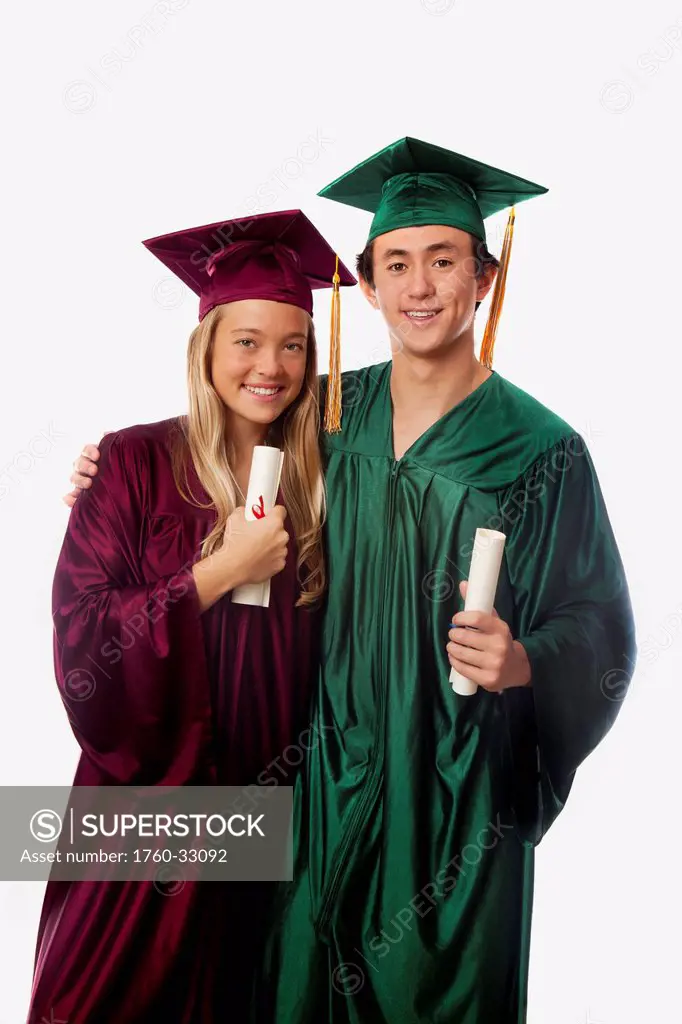 Male And Female Graduates In Cap And Gown, Holding Diplomas.