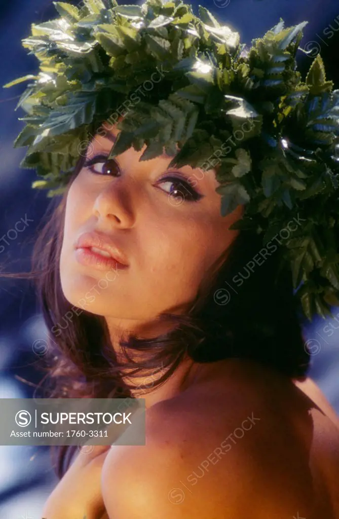 Close-up of beautiful Hawaiian girl wearing haku lei
