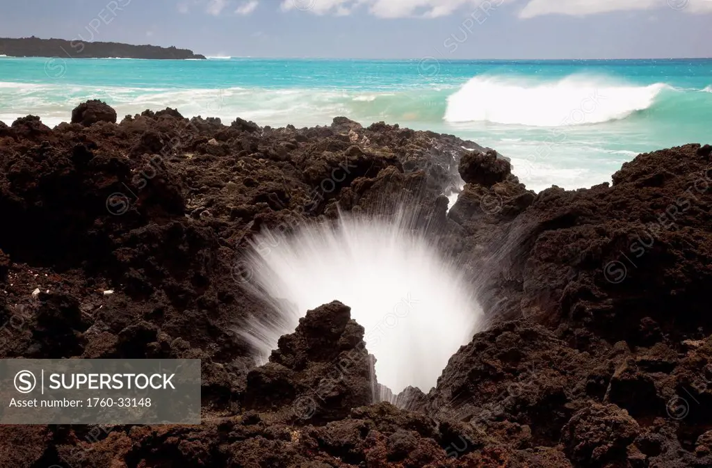 Hawaii, Maui, La Perouse Bay, A Burst Of Water Through A Blowhole In Some Lava Rocks.