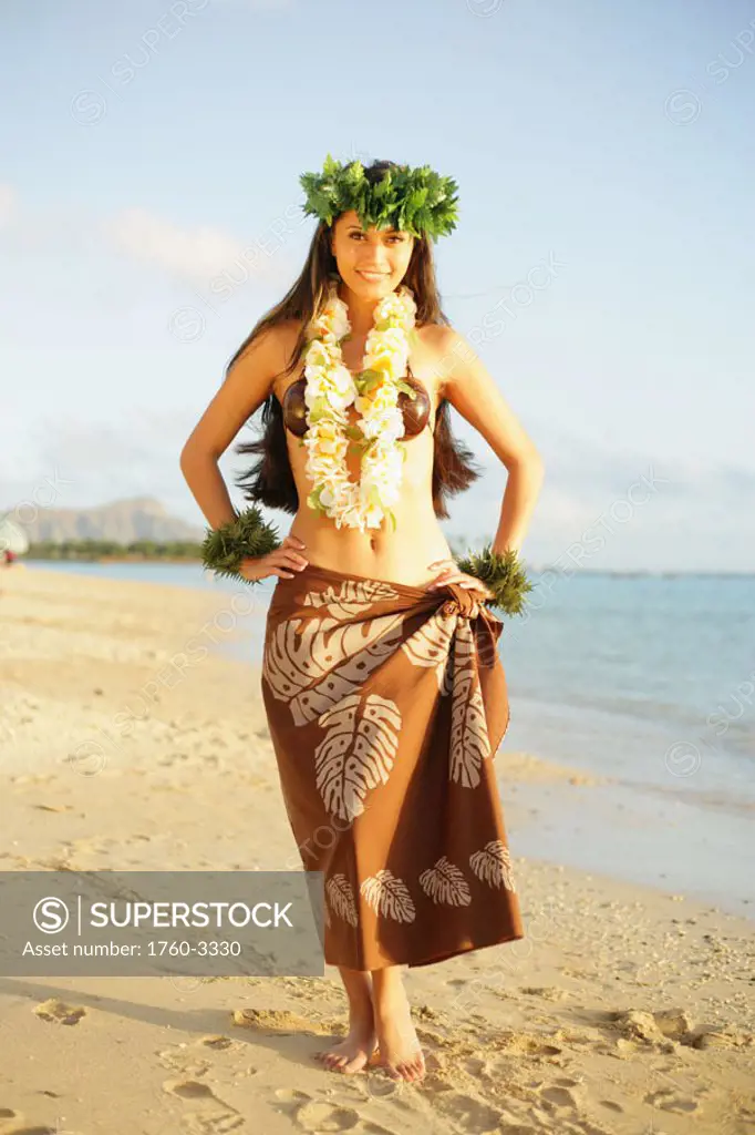 Beautiful Hawaiian hula girl on a tropical beach.