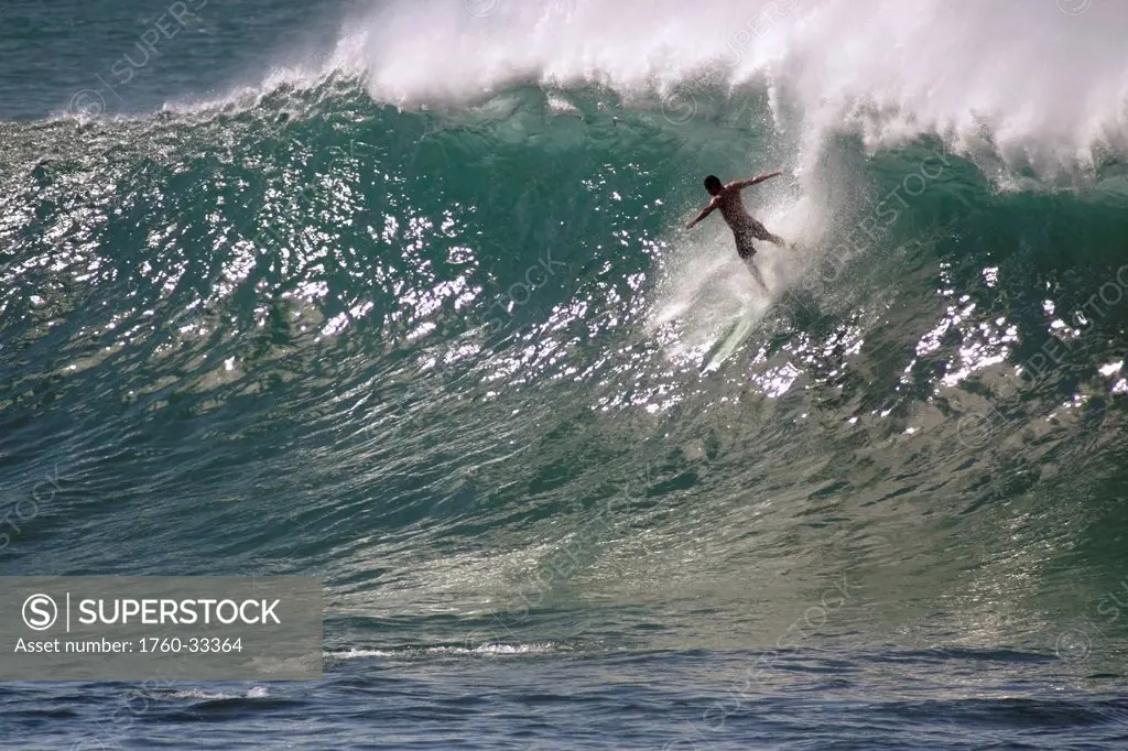 Hawaii, Waimea Bay, Man Surfing A Large Wave.