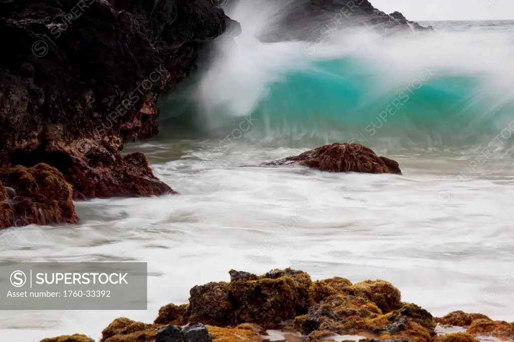 Hawaii, Maui, Makena, An Ocean Wave Crashes Among A Lava Coast.