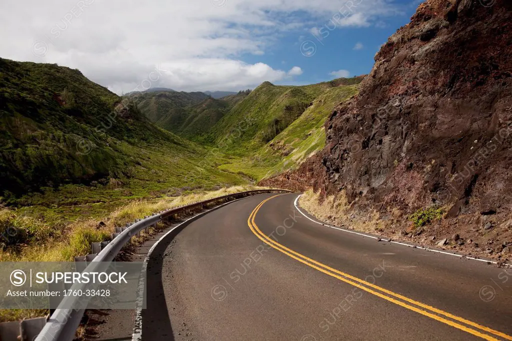 Hawaii, Maui, A Winding Road Through Maui's West Side With Lush Mountains.
