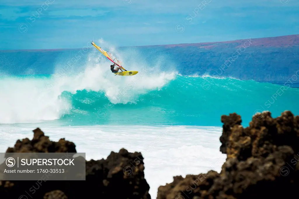Hawaii, Maui, Laperouse, Professional Windsurfer Kail Lenny riding a large wave at Laperouse Bay.