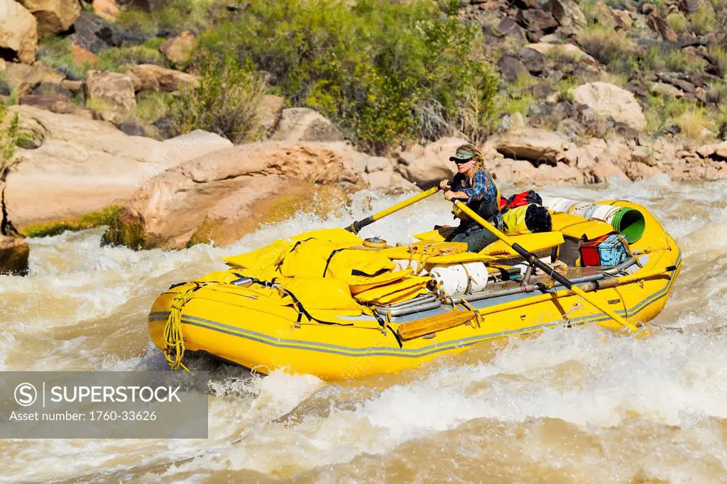 Arizona, Grand Canyon National Park, Woman rafting on the Colorado River. EDITORIAL USE ONLY.