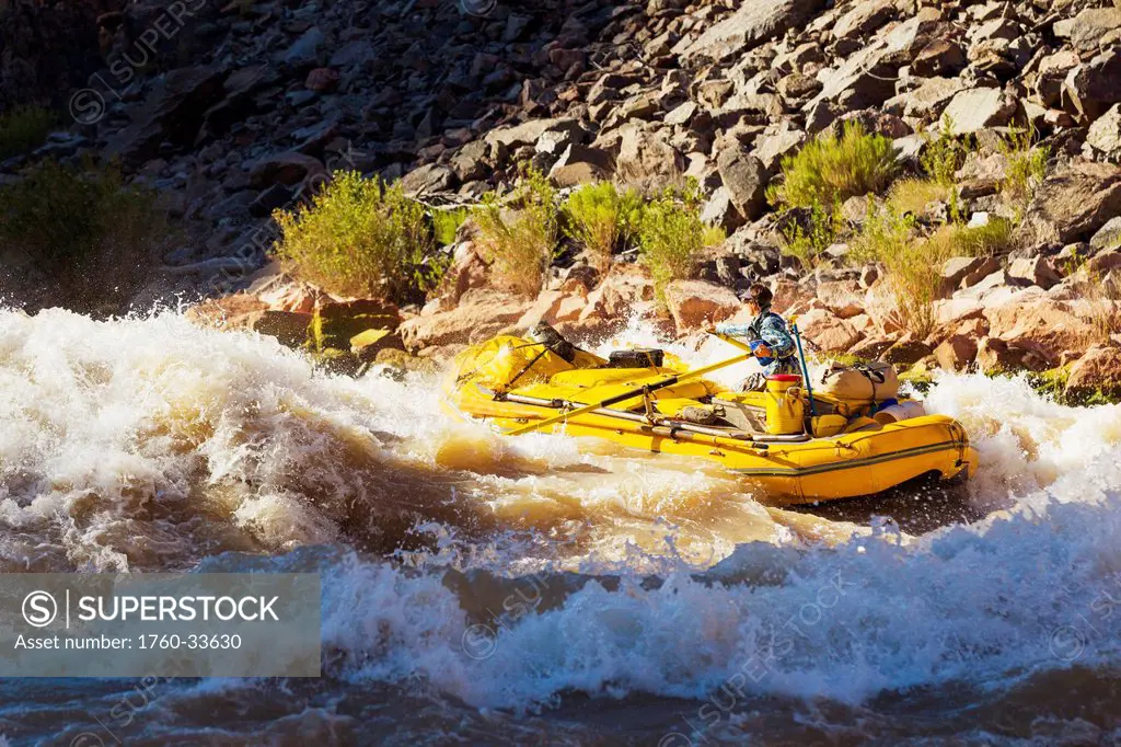 Arizona, Grand Canyon National Park, Man rafting on the Colorado River, Large rapids. EDITORIAL USE ONLY.