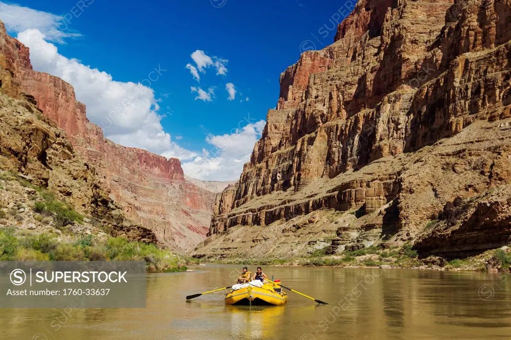 Arizona, Grand Canyon National Park, Two friends rafting on the Colorado River, Calm water. EDITORIAL USE ONLY.
