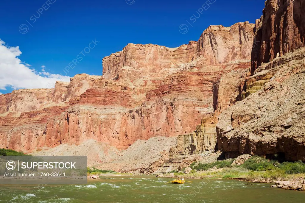 Arizona, Grand Canyon National Park, Young man rafting on the Colorado River, Calm water. EDITORIAL USE ONLY.