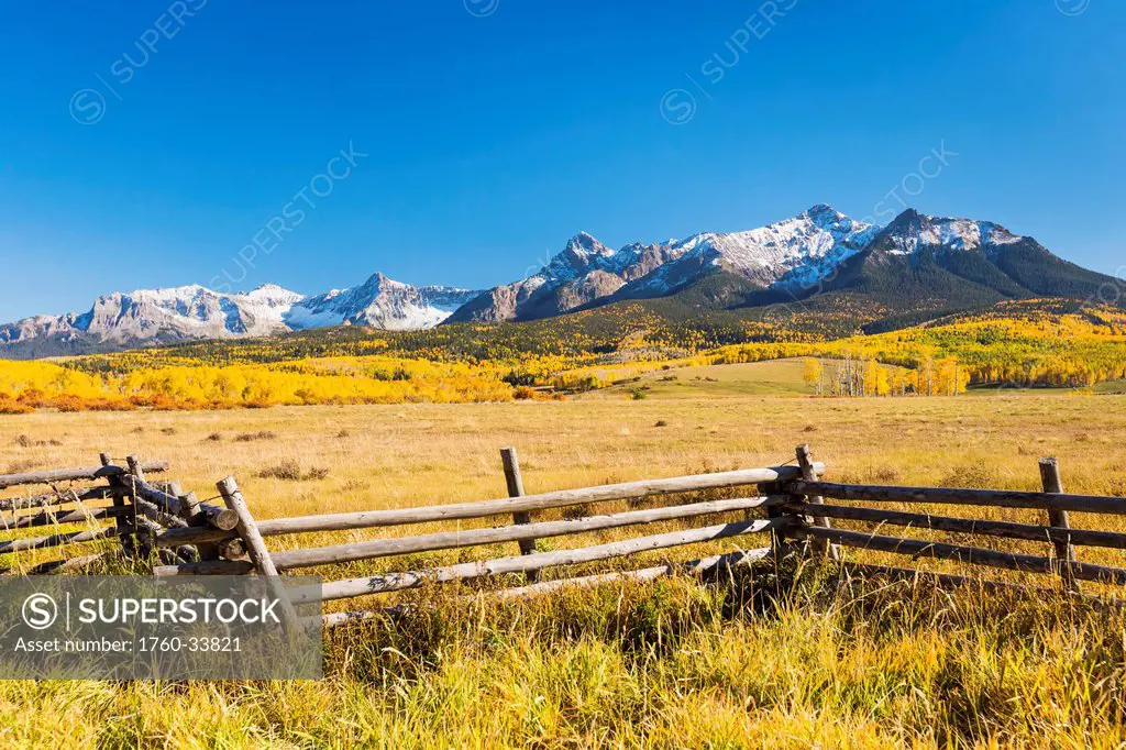 Colorado, Dallas Divide, Beautiful Autumn landscape, Snow covered Aspen Mountains in distance.