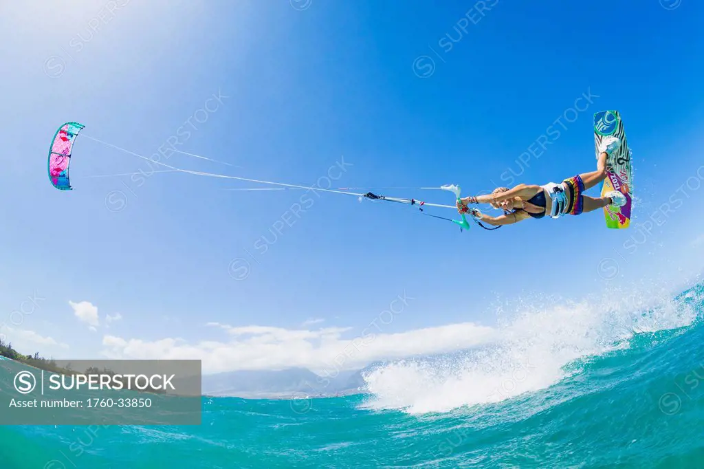 Hawaii, Maui, Professional Kiteboarder Susi Mai catching air off the North Shore. EDITORIAL USE ONLY.