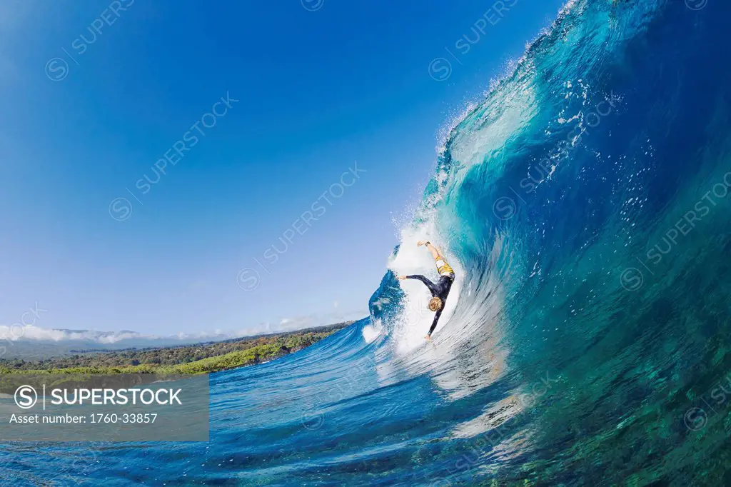 Hawaii, Maui, Surfer falling off his board on a large wave. EDITORIAL USE ONLY.