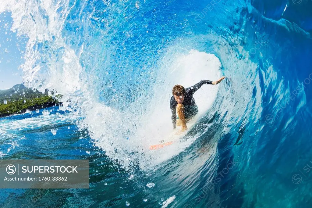 Hawaii, Maui, Professional surfer Hank Gaskell in the tube of a wave. EDITORIAL USE ONLY.