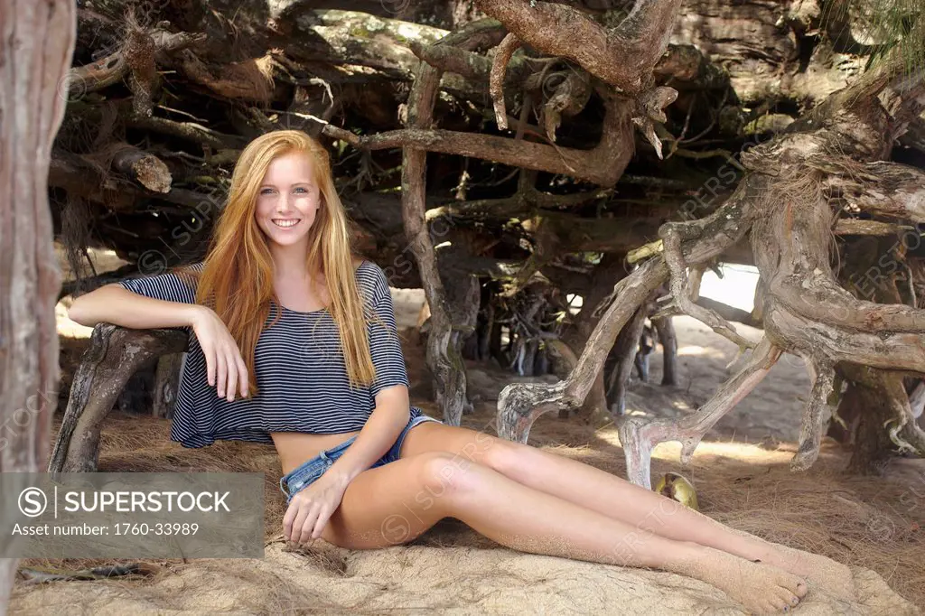 Portrait of a young woman on Tunnel's beach; Kauai, Hawaii, United States of America