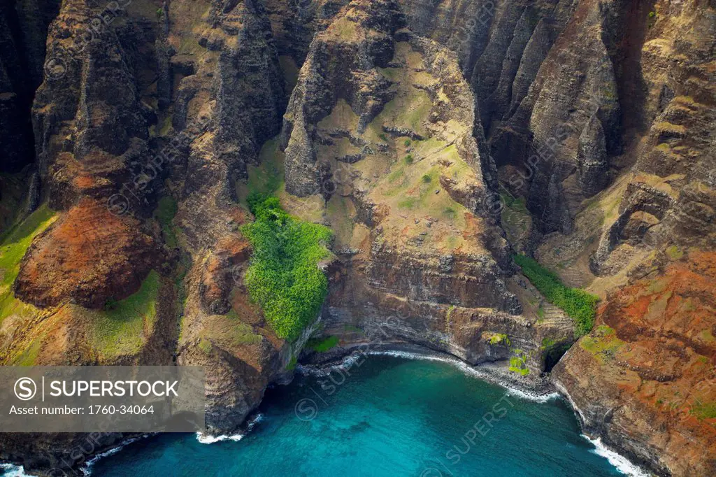 Aerial view of the rugged coastline along an hawaiian island; Hawaii, United States of America