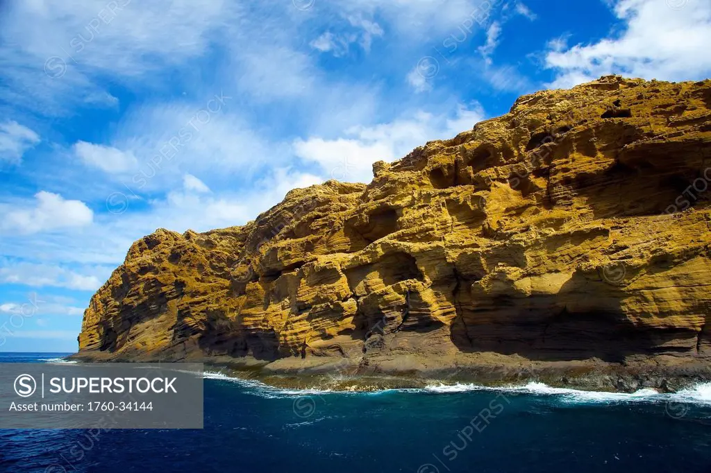 Rugged rock on the coastline of an hawaiian island; Hawaii, United States of America