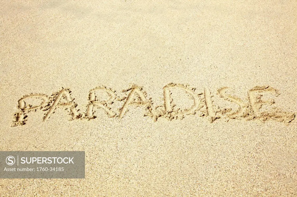 The word paradise written in the sand; Hawaii, United States of America