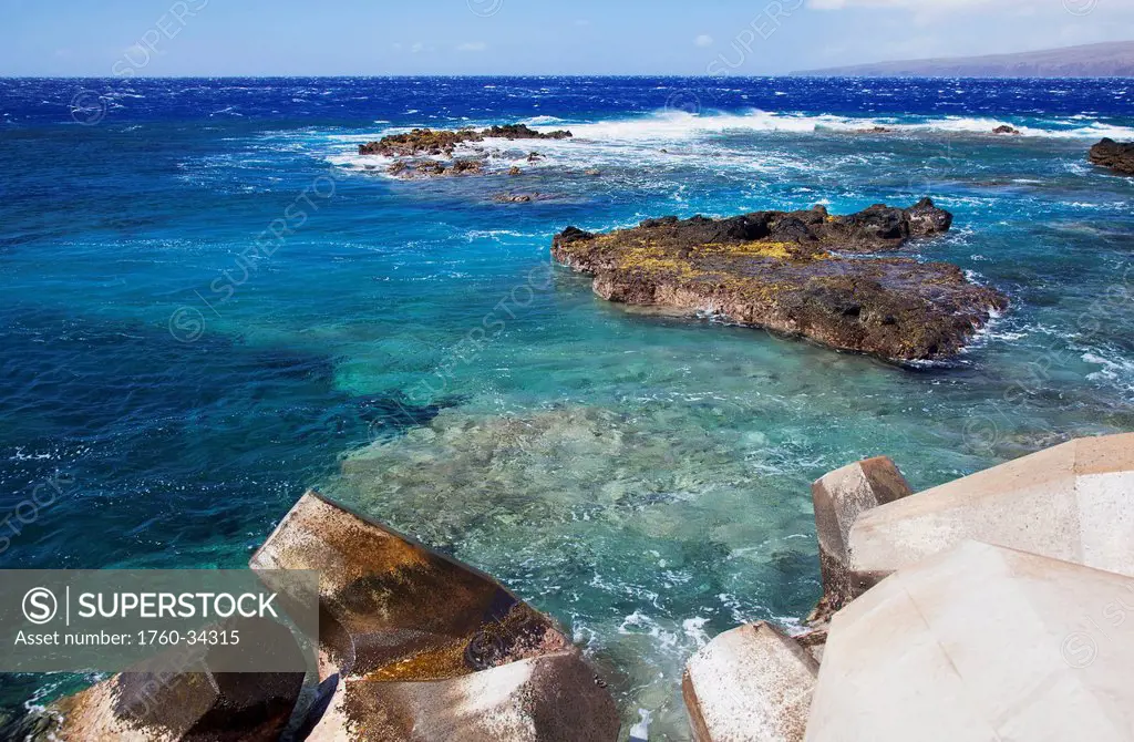 Bright clear water and rock formations at Kaumalapau Harbour; Lanai, Hawaii, United States of America