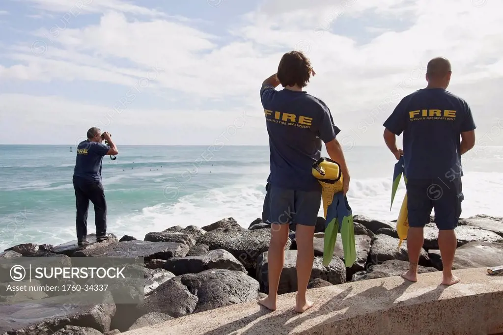 Members of the Honolulu Fire Department are called out to the beach for search and rescue mission; Honolulu, Oahu, Hawaii, United States of America