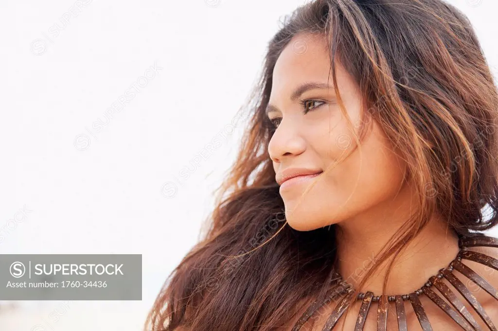 Portrait of a young woman with long brunette hair; Oahu, Hawaii, United States of America