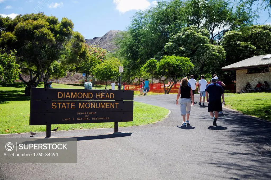 Tourists walking on a path at Diamond Head State Monument; Honolulu, Oahu, Hawaii, United States of America