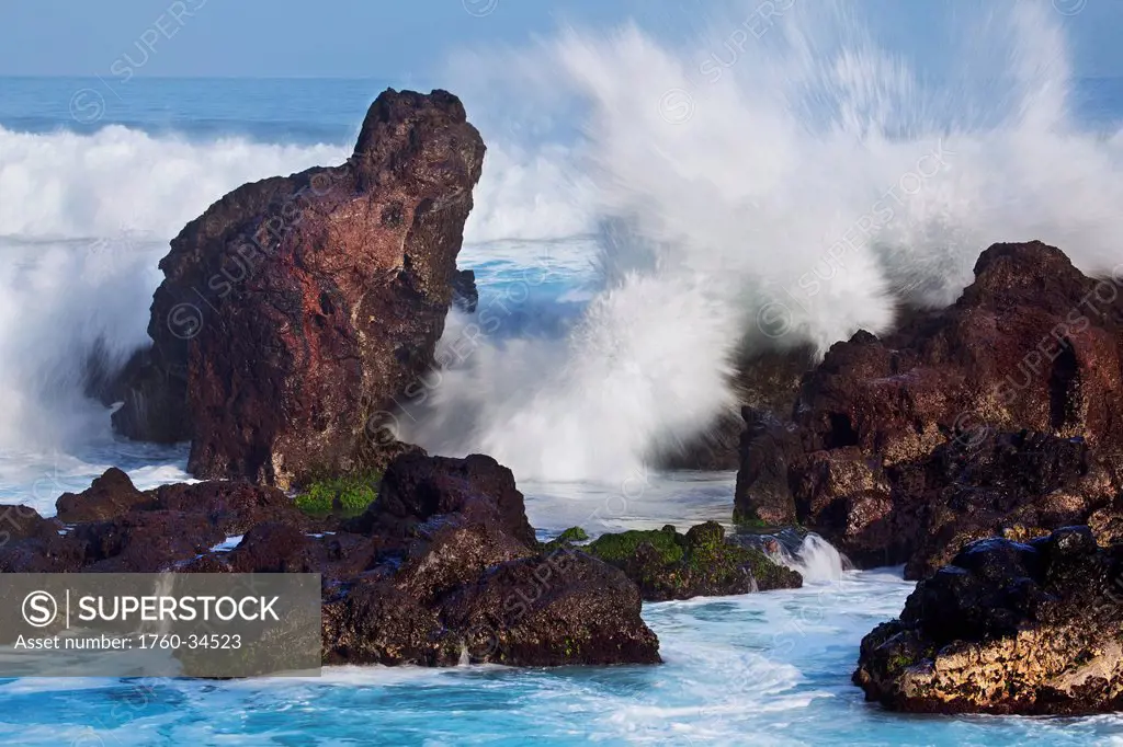 A wave crashes onto lava; Hookipa, Maui, Hawaii, United States of America