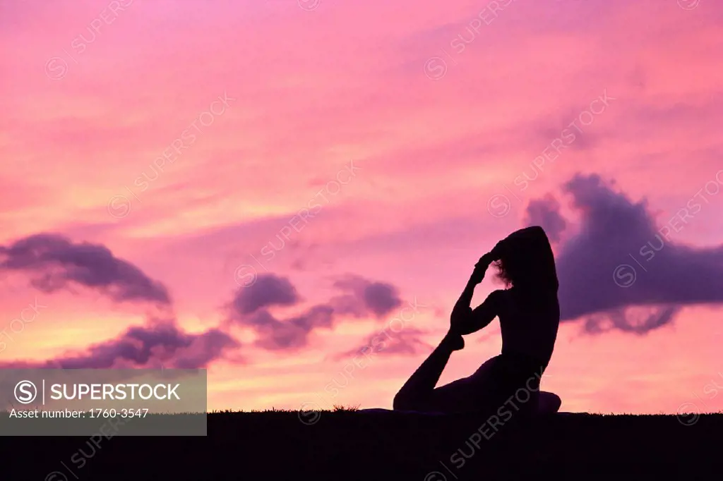 Woman doing yoga on beach at sunset w/ pink skies, Wailea, Maui B1205