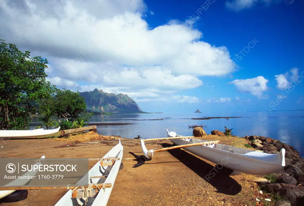 Hawaii, Oahu, Waiahole, outrigger canoes on beach, turquoise water
