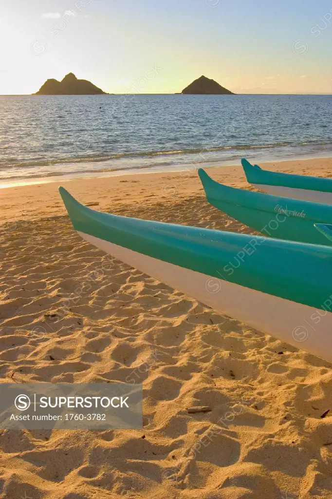 Hawaii, Oahu, Outrigger canoes on Lanikai beach at sunrise