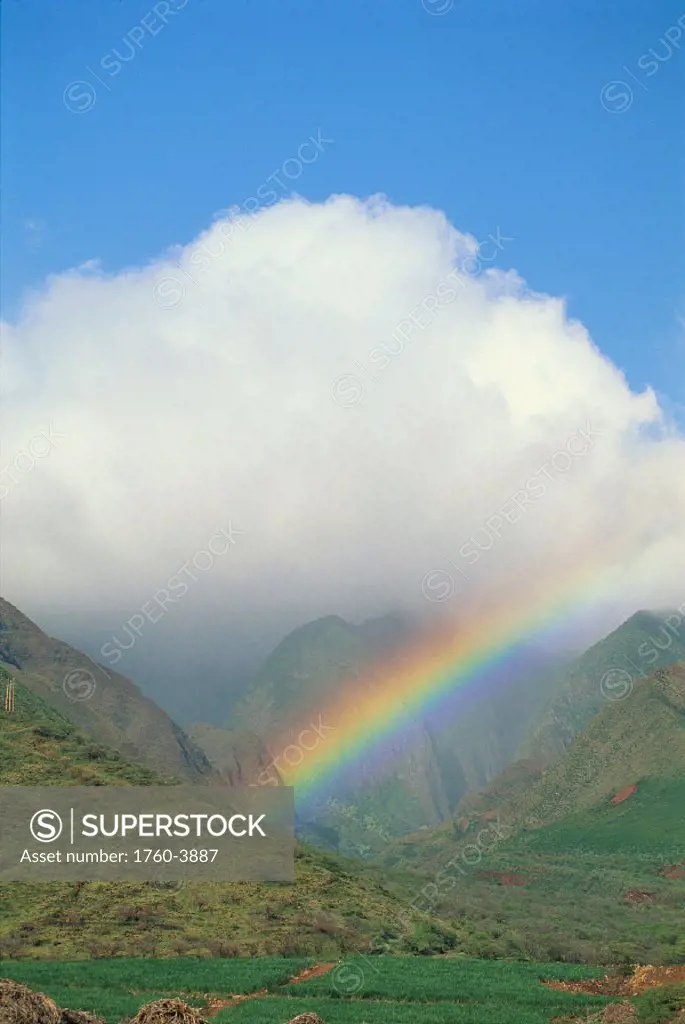 Hawaii, Rainbow into West Maui Mountains, large puffy cloud, blue sky A48F