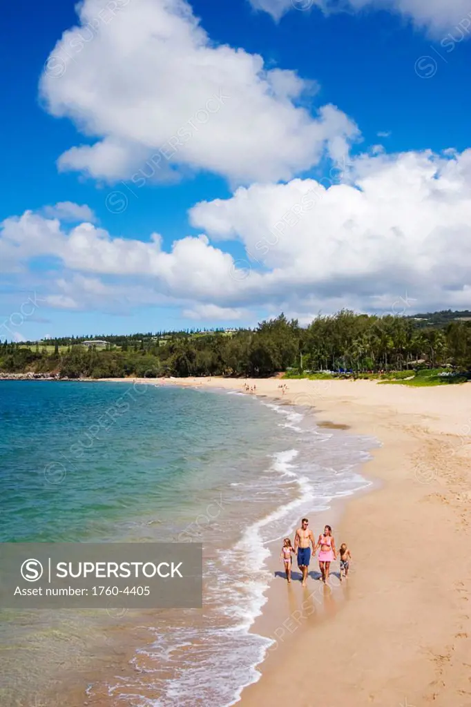 Hawaii, Maui, Kapalua, Fleming Beach, Family on vacation walking down the beach.