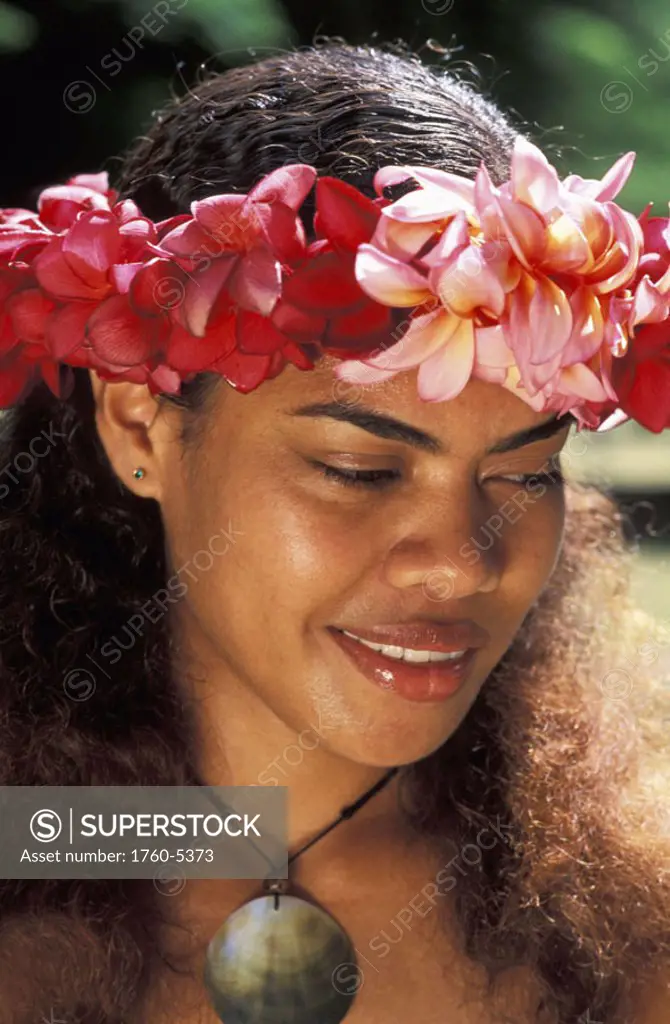 Fiji, Beautiful young local woman, wearing flower haku, close-up of face.