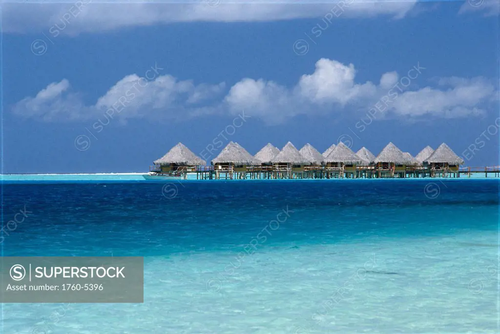 French Polynesia, Bora Bora, Hotel Moana Beach, huts over turquoise ocean A56F