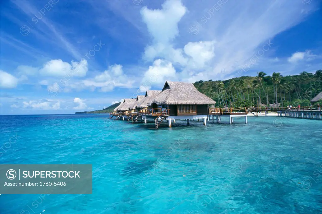 FP, Bora Bora Lagoon Resort, View of bungalows over ocean palm lined beach bkgd C1776