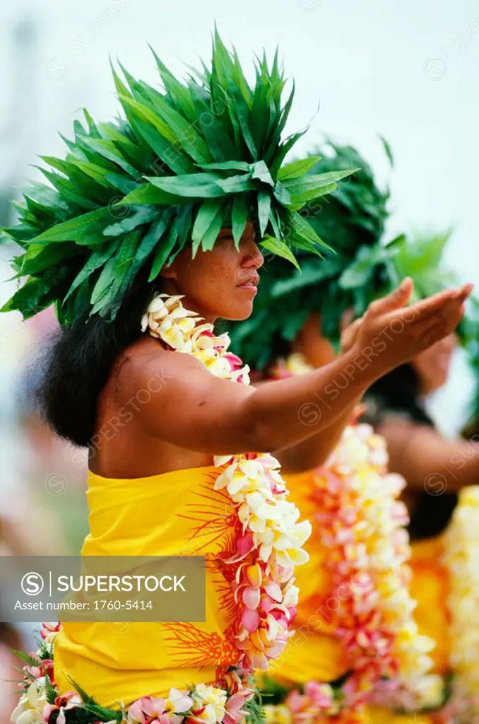 French Polynesia, Bor Bora, Tahitian Dancers in native costume, green plant headresses.