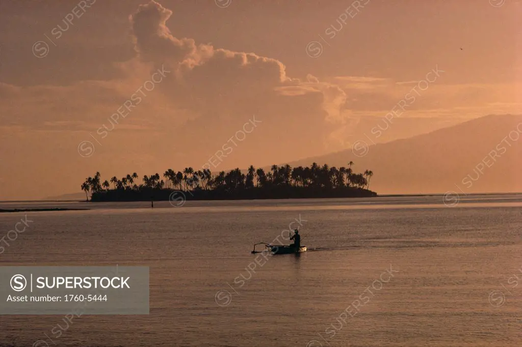 French Polynesia, view from Moorea at dusk fisherman, motu Tahiti background A57G